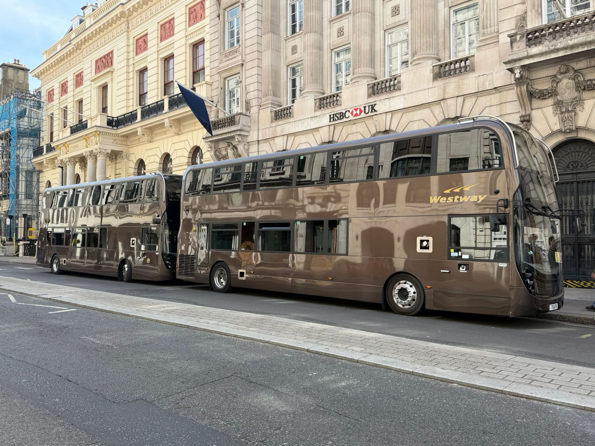 Two bronze Westway double-decker coaches in central London